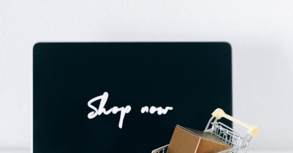 Minimalist online shopping setup with laptop, cart, and packages symbolizing e-commerce.